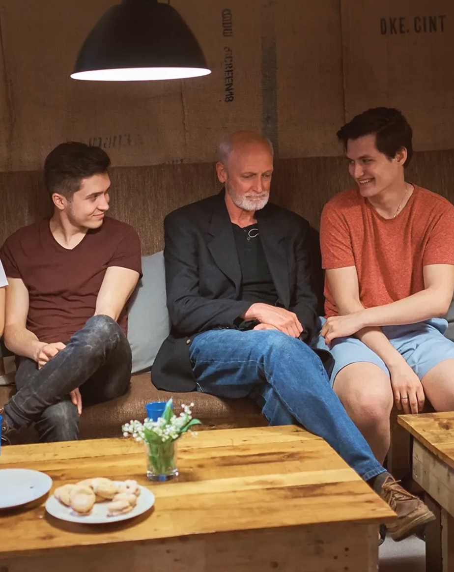 Michael Pratt in conversation with two young men during a mentoring session